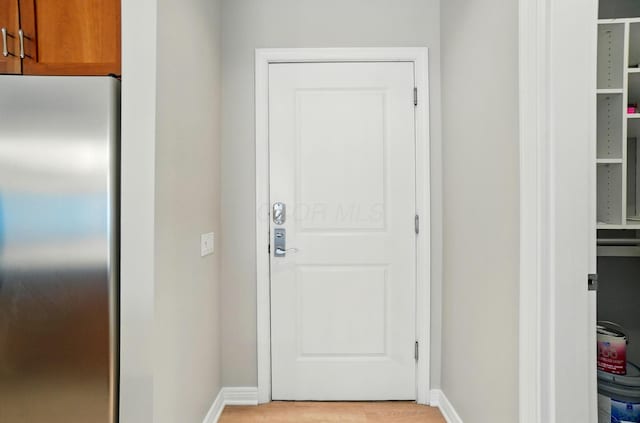 250 Daniel Burnham Sq Unit 304, Columbus, OH 43215 - entryway with baseboards and light wood finished floors
