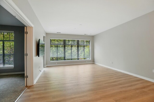 250 Daniel Burnham Sq Unit 304, Columbus, OH 43215 - empty room featuring healthy amount of natural light and light wood-type flooring