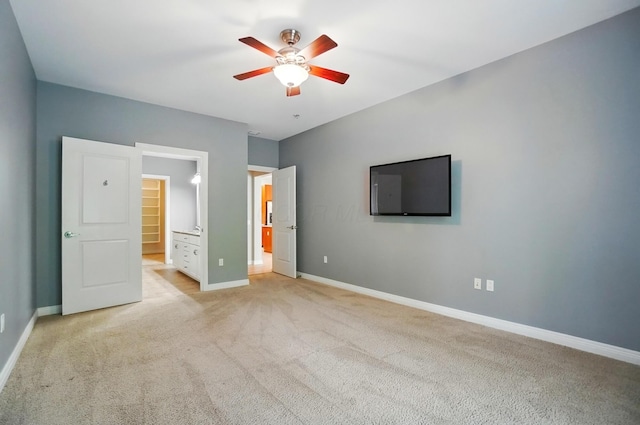 250 Daniel Burnham Sq Unit 304, Columbus, OH 43215 - unfurnished bedroom featuring light colored carpet, ceiling fan, and connected bathroom