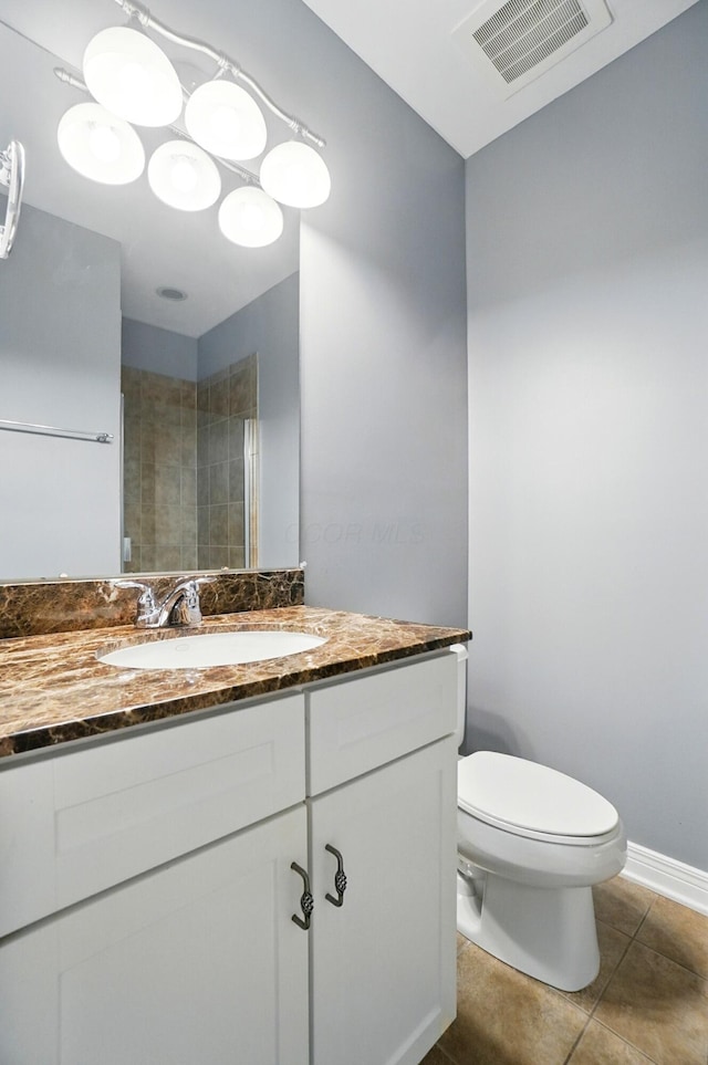 250 Daniel Burnham Sq Unit 304, Columbus, OH 43215 - bathroom featuring vanity, tile patterned floors, and tiled shower