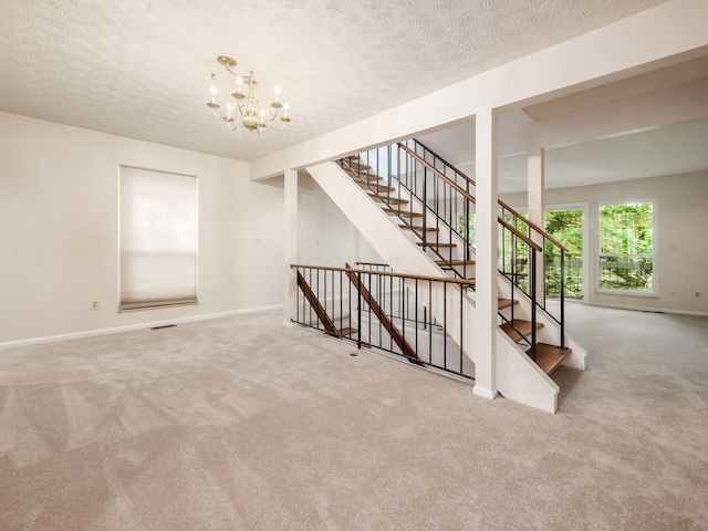 3120 Walden Ravines, Columbus, OH 43221 - stairs with carpet, a chandelier, baseboards, and a textured ceiling