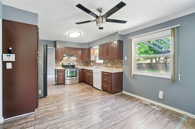 2605 Bella Via Ave, Columbus, OH 43231 - kitchen with stainless steel range with electric stovetop, dishwasher, ceiling fan, light countertops, and under cabinet range hood