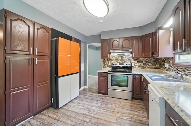2605 Bella Via Ave, Columbus, OH 43231 - kitchen featuring stainless steel electric range, a sink, dishwasher, under cabinet range hood, and refrigerator