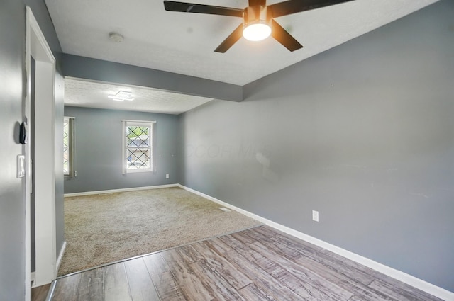 2605 Bella Via Ave, Columbus, OH 43231 - unfurnished room with wood finished floors, baseboards, a smoke detector, and ceiling fan
