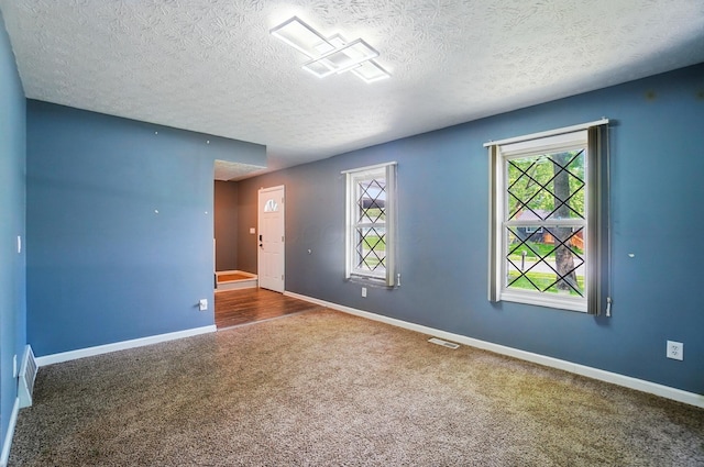 2605 Bella Via Ave, Columbus, OH 43231 - carpeted spare room with baseboards and a textured ceiling