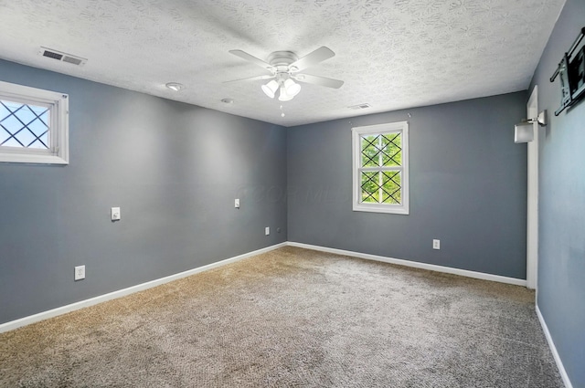 2605 Bella Via Ave, Columbus, OH 43231 - carpeted spare room featuring a ceiling fan, baseboards, and a textured ceiling