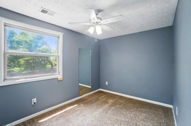 2605 Bella Via Ave, Columbus, OH 43231 - carpeted empty room featuring a ceiling fan, baseboards, and a textured ceiling