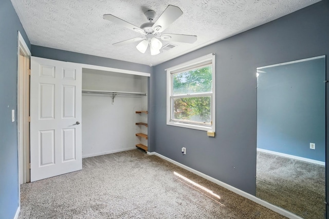 2605 Bella Via Ave, Columbus, OH 43231 - unfurnished bedroom featuring carpet floors, a closet, baseboards, a textured ceiling, and ceiling fan