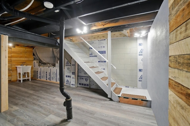 2605 Bella Via Ave, Columbus, OH 43231 - unfinished below grade area featuring wood finished floors, a sink, and stairway
