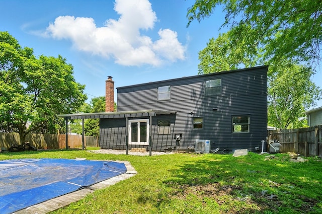 2605 Bella Via Ave, Columbus, OH 43231 - rear view of property featuring a chimney and ac unit