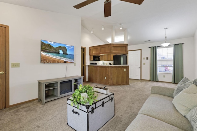 1318 Hillview Cir E, Newark, OH 43055 - living room with light colored carpet, vaulted ceiling, ceiling fan, and baseboards