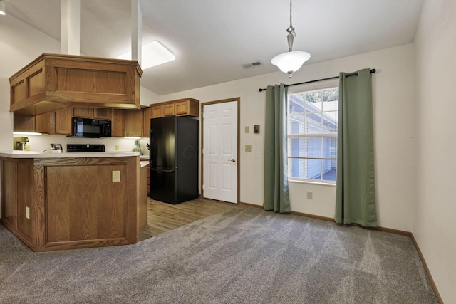 1318 Hillview Cir E, Newark, OH 43055 - kitchen featuring black appliances, light carpet, brown cabinets, vaulted ceiling, and a peninsula