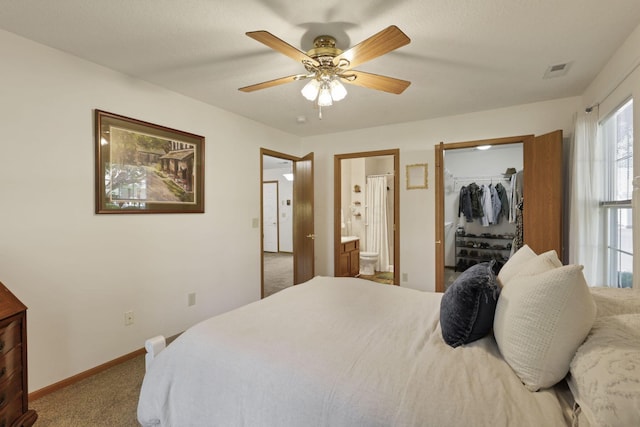1318 Hillview Cir E, Newark, OH 43055 - carpeted bedroom with baseboards, ensuite bath, a spacious closet, ceiling fan, and a closet