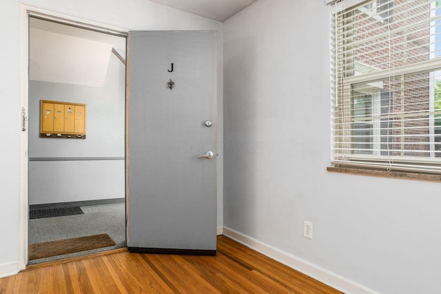 1775 NW Ct Unit 114 J, Columbus, OH 43212 - interior space featuring wood finished floors, baseboards, vaulted ceiling, and a closet