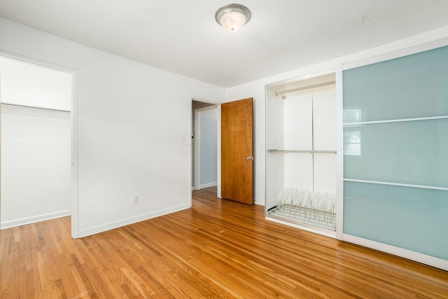 1775 NW Ct Unit 114 J, Columbus, OH 43212 - unfurnished bedroom with wood finished floors and baseboards