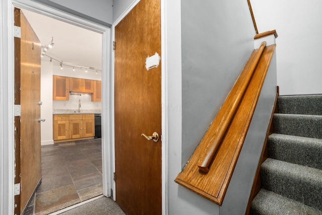1775 NW Ct Unit 114 J, Columbus, OH 43212 - staircase featuring rail lighting, stone finish flooring, and baseboards