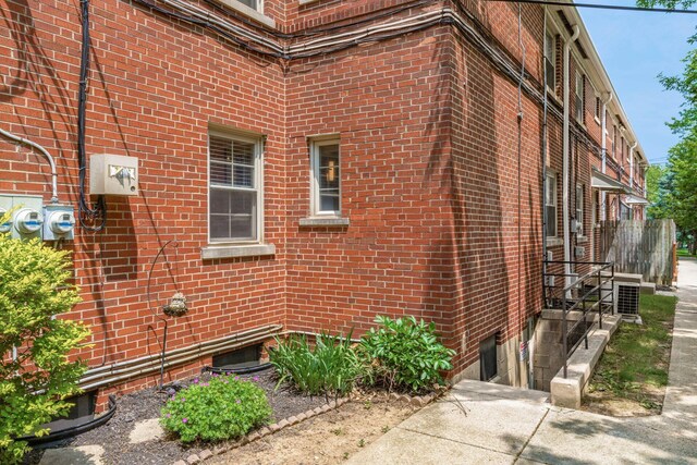 1775 NW Ct Unit 114 J, Columbus, OH 43212 - view of side of property featuring brick siding and central AC