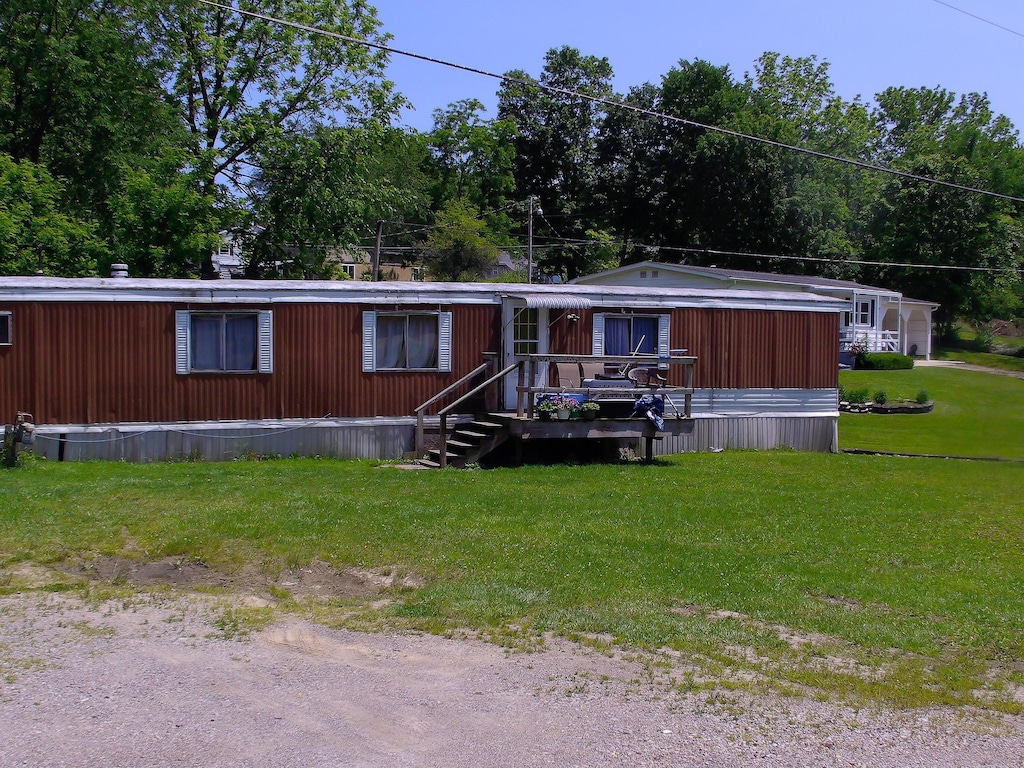 8190 New Marshfield Rd, New Marshfield, OH 45766 - manufactured / mobile home with a front lawn