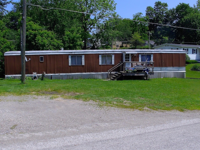 8190 New Marshfield Rd, New Marshfield, OH 45766 - manufactured / mobile home featuring a front lawn