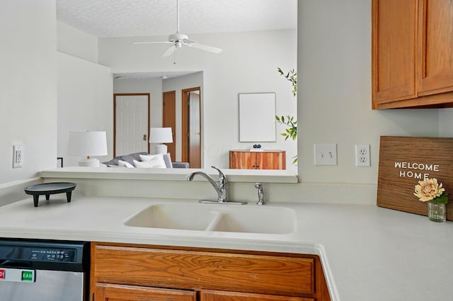 4557 Hidden Ridge Ct, Columbus, OH 43230 - kitchen with stainless steel dishwasher, a sink, light countertops, a ceiling fan, and brown cabinetry
