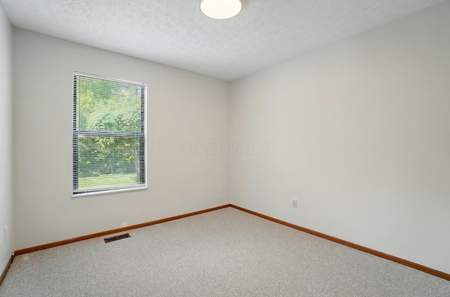 4557 Hidden Ridge Ct, Columbus, OH 43230 - carpeted spare room with baseboards and a textured ceiling