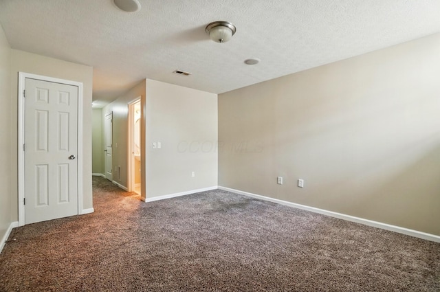 5629 Middle Falls St, Dublin, OH 43016 - carpeted empty room with baseboards and a textured ceiling
