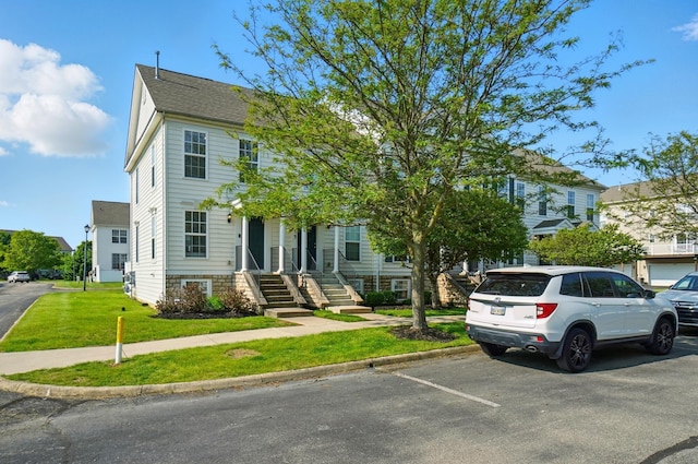 5629 Middle Falls St, Dublin, OH 43016 - view of property with uncovered parking and a front yard