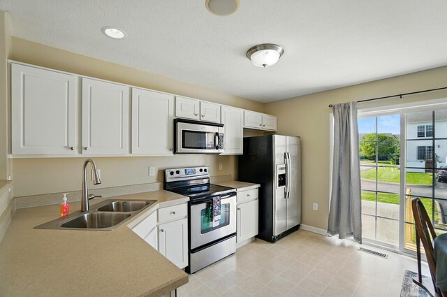 5629 Middle Falls St, Dublin, OH 43016 - kitchen featuring appliances with stainless steel finishes, white cabinets, and light countertops