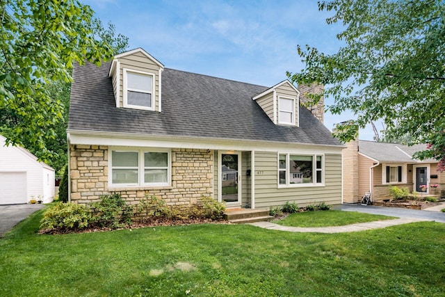 677 E Weisheimer Rd, Columbus, OH 43214 - cape cod-style house with stone siding, a front yard, a chimney, an outbuilding, and roof with shingles