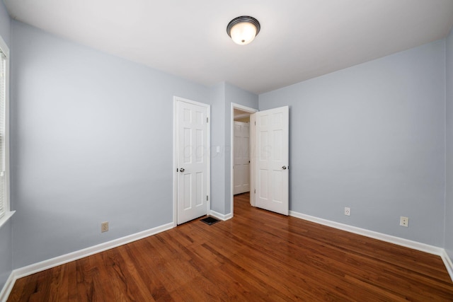 677 E Weisheimer Rd, Columbus, OH 43214 - unfurnished bedroom featuring baseboards and wood finished floors