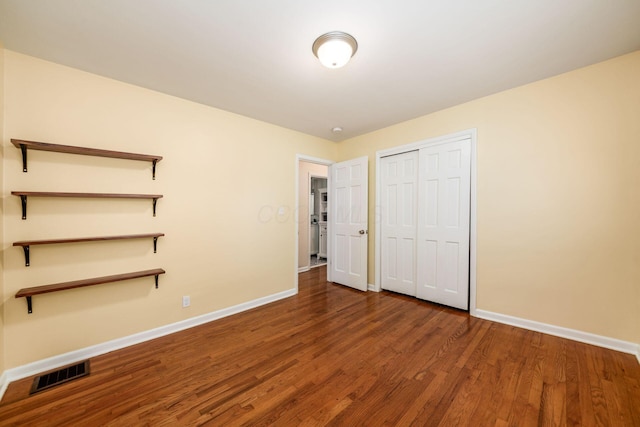 677 E Weisheimer Rd, Columbus, OH 43214 - unfurnished bedroom with baseboards, wood finished floors, and a closet