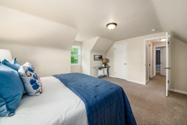 677 E Weisheimer Rd, Columbus, OH 43214 - carpeted bedroom with lofted ceiling and baseboards