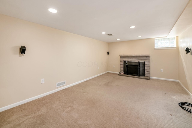 677 E Weisheimer Rd, Columbus, OH 43214 - unfurnished living room featuring light carpet, a fireplace with raised hearth, recessed lighting, and baseboards