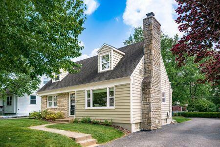 677 E Weisheimer Rd, Columbus, OH 43214 - cape cod-style house with a chimney and a front yard
