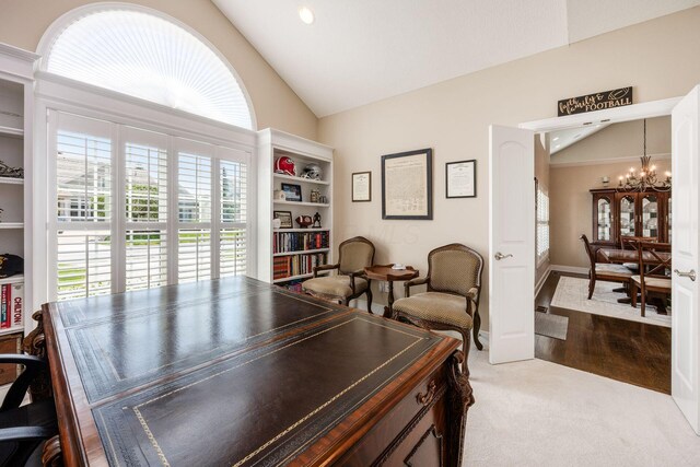 7908 Coldwater Dr, Powell, OH 43065 - office area with a chandelier, carpet, and high vaulted ceiling