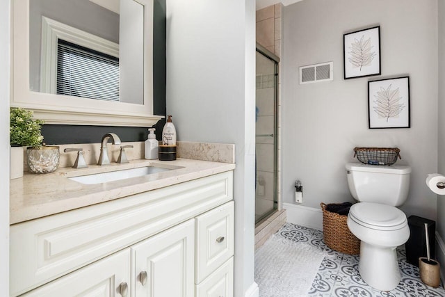 369 E Main St, Circleville, OH 43113 - bathroom with vanity, toilet, a stall shower, and baseboards