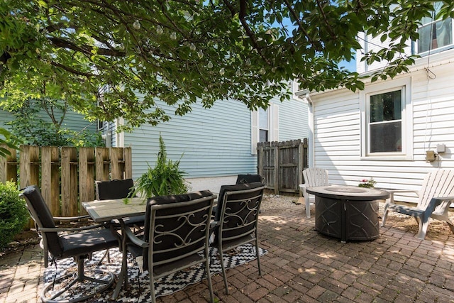 369 E Main St, Circleville, OH 43113 - view of patio with outdoor dining area and a fire pit