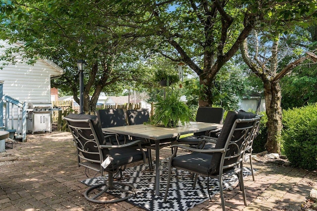369 E Main St, Circleville, OH 43113 - view of patio featuring outdoor dining space and a grill