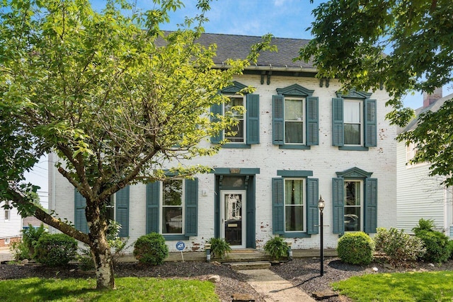 369 E Main St, Circleville, OH 43113 - view of front of house featuring brick siding and roof with shingles