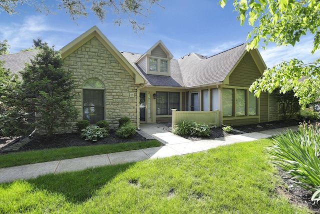 53 Stone House Ct, Newark, OH 43055 - view of front of property with stone siding, a front lawn, and a shingled roof