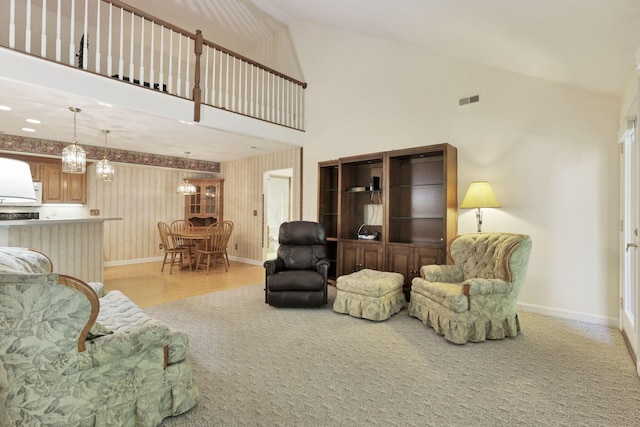 53 Stone House Ct, Newark, OH 43055 - living room featuring baseboards, high vaulted ceiling, and light wood-type flooring