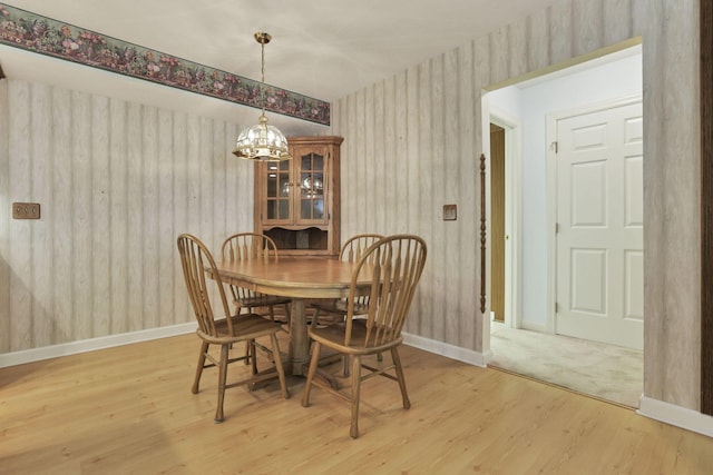 53 Stone House Ct, Newark, OH 43055 - dining space with a chandelier, light wood-style floors, baseboards, and wallpapered walls