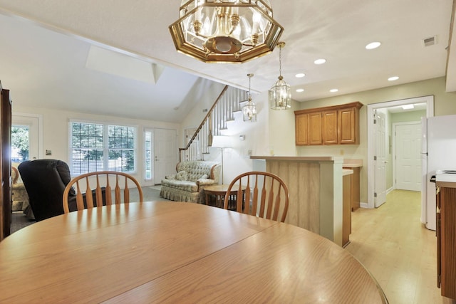 53 Stone House Ct, Newark, OH 43055 - dining space featuring a chandelier, stairway, recessed lighting, light wood finished floors, and baseboards