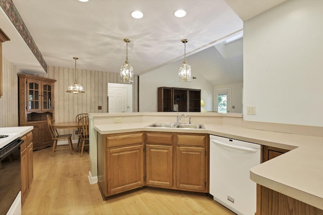 53 Stone House Ct, Newark, OH 43055 - kitchen with white appliances, a sink, light countertops, light wood-type flooring, and decorative light fixtures
