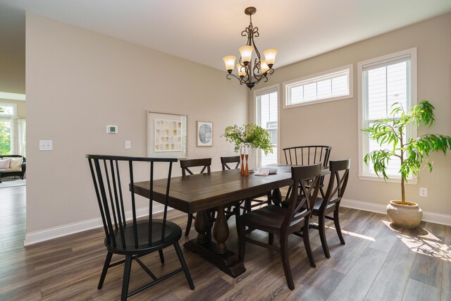 829 Pathlow Dr, Pickerington, OH 43147 - dining area featuring dark wood-style flooring, healthy amount of natural light, and a chandelier