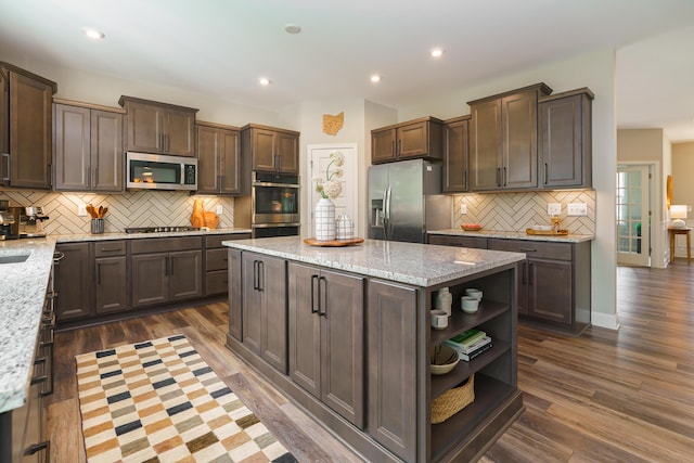 829 Pathlow Dr, Pickerington, OH 43147 - kitchen with appliances with stainless steel finishes, open shelves, a kitchen island, dark brown cabinets, and decorative backsplash