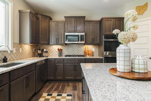 829 Pathlow Dr, Pickerington, OH 43147 - kitchen featuring stainless steel appliances, dark brown cabinetry, dark wood finished floors, backsplash, and recessed lighting