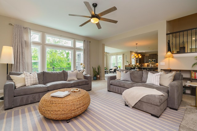 829 Pathlow Dr, Pickerington, OH 43147 - living area with carpet floors, a chandelier, and a ceiling fan