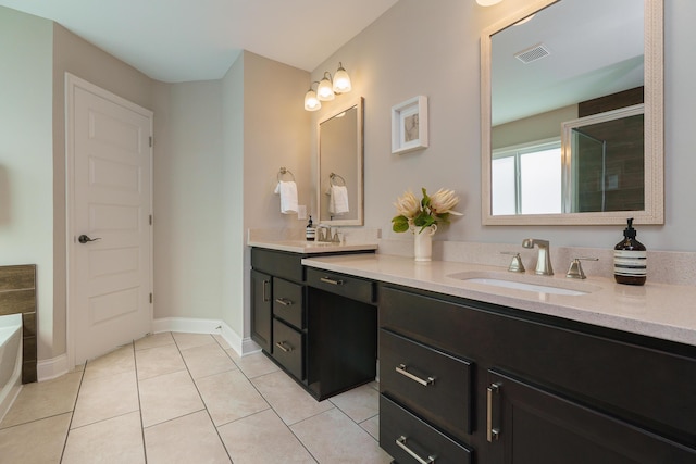 829 Pathlow Dr, Pickerington, OH 43147 - full bathroom featuring double vanity, tile patterned flooring, and a garden tub