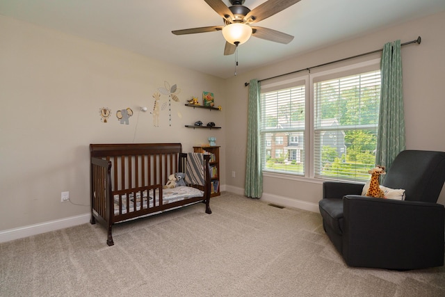829 Pathlow Dr, Pickerington, OH 43147 - bedroom featuring a crib, light colored carpet, and a ceiling fan